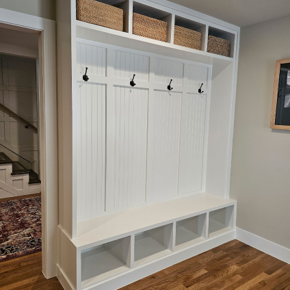 a white coat rack with custom shelves made by renovacraft